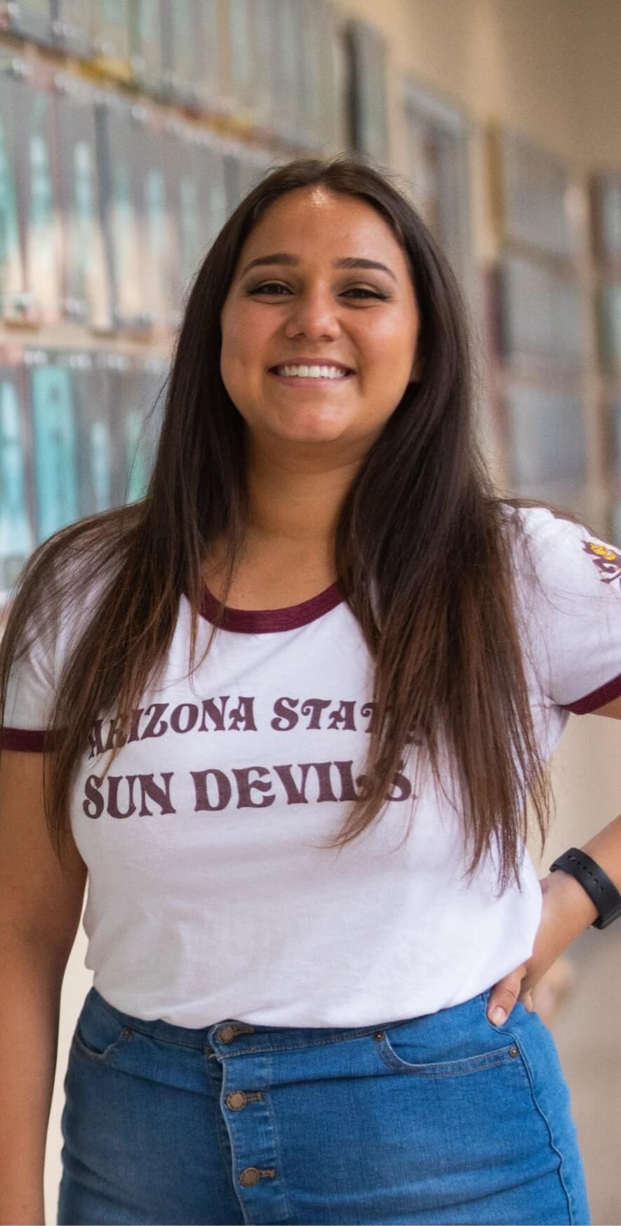 A student in the Pathways for the Future program poses in an ASU shirt.